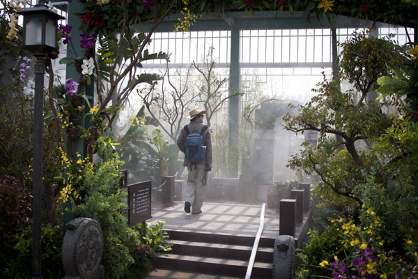 A man visits the Garden Expo site in Beijing on Friday. The event will open on May 18, while trial operations will start on Sunday. Beijing's Garden Expo ready for trial run on Sunday