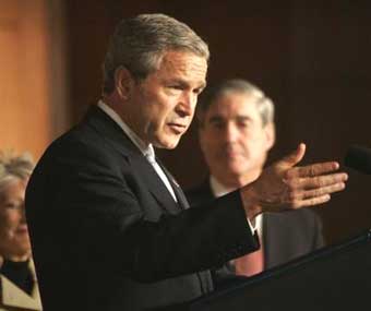 US President Bush makes remarks before signing into law the The Intelligence Reform and Terrorism Prevention Act of 2004, Friday, Dec. 17, 2004, in Washington. The new law is the largest overhaul of U.S. intelligence gathering in 50 years, hoping to improve the spy network that failed to prevent the Sept. 11 attacks. [AP]