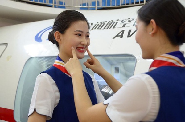 Grinning faces on World Smile Day