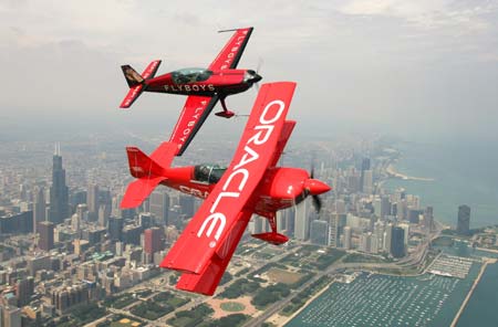 Sean Tucker (front) and David Ellison fly over Chicago in preparation for the 88th annual Chicago Air and Water Show August 17, 2006. The event will begin August 19, 2006.