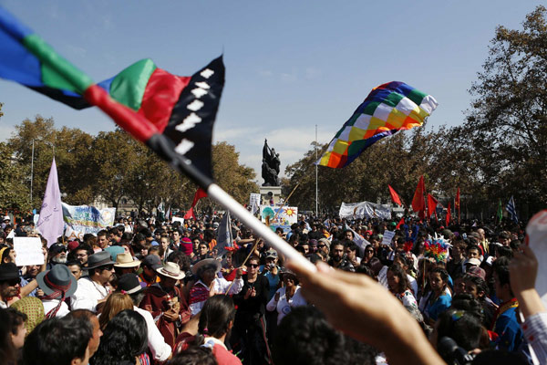 Participants attend a parade commemorating Earth Day in downtown Santiago, April 22, 2013. Students and environmental interest organisations participated in the parade, themed 'March for the Protection of Water'. Earth Day marked around the world
