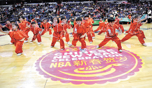Chinese children perform kung fu in celebration of Chinese New Year before a game between the Washington Wizards and the Brooklyn Nets on Feb 8 in Washington. Having a ball - China style