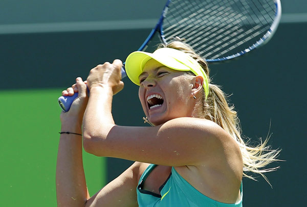 Russia's Maria Sharapova follows through on a shot to Serena Williams of the US in their women's singles final match at the Sony Open tennis tournament in Key Biscayne, Florida March 30, 2013. Serena beats Sharapova in Sony Open final