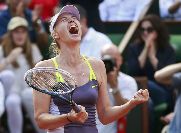 Maria Sharapova of Russia celebrates defeating Victoria Azarenka of Belarus in their women's singles semi-final match during the French Open tennis tournament at the Roland Garros stadium in Paris, June 6, 2013. Serena mauls Errani, Sharapova awaits in final